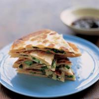 Scallion Pancake · Savory, unleavened flatbread folded with vegetable oil and minced scallions

Vegetarian