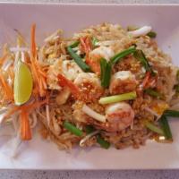House Pad Thai · Rice noodle stir fried with chicken & shrimp, egg, turnip, scallions, bean sprouts 7 peanuts.