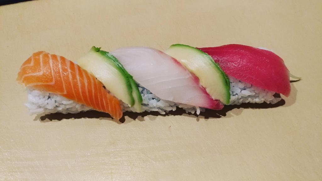 27. Rainbow Roll · California roll topped with avocado, tuna, yellowtail and salmon.