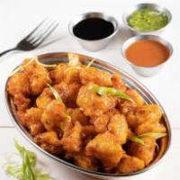 Manchurian Style · Spicy and tangy sauce tossed with your choice. Served with steamed rice.