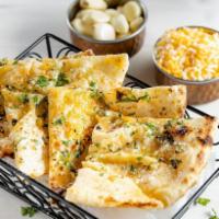 Garlic Cheese Naan · Flat bread stuffed with garlic and cheese. Vegetarian.