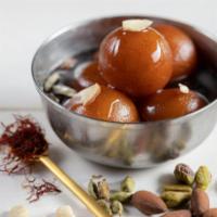Gulab Jamun · Soft donut holes made with powdered milk,soaked in cardamon syrup. Vegetarian.