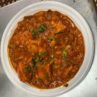 Chicken Curry · Chicken cooked with onions and tomato-based sauce, flavored with ginger, garlic, chilly pepp...