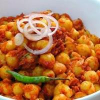 Channa Masala · Chick peas cookes with special creamy sauce flavored with turmeric and cumin.