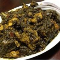 Gongura Chicken Curry · Bone in chicken cooked with spicy gongura leaves.