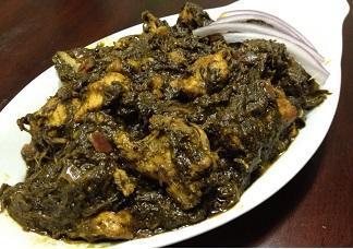 Gongura Chicken Curry · Bone in chicken cooked with spicy gongura leaves.