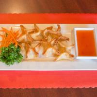 A11. Crab Cheese · Cream cheese with imitation crab meat, green onions and white onions wrapped in wonton skin....