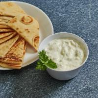 Tzatziki Yogurt  · Greek yogurt, cucumbers, mint served with pita bread.
