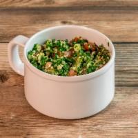 Tabbouleh Salad · Finely chopped parsley, diced tomato, cucumber, onions and bulgar wheat. Vegetarian.
