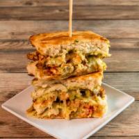 Basil Pesto Chicken Sandwich · Basil pesto drizzled grilled chicken breast with roasted red bell pepper and provolone chees...