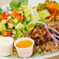 Chicken Kebab Plate · 2 skewers of grilled chicken breast kababs. Served with rice, salad, hummus & pita bread. Su...