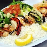 Shrimp Kabab Plate · 2 skewers of wild gulf jumbo shrimp kababs. Served with rice, salad, hummus & pita bread. Su...