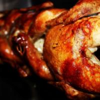 Whole Chicken a la Carte · Whole Rotisserie Chicken, 2 breasts and wings, 2 legs and thighs. Served with Garlic Sauce.
