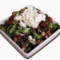 The Real Greek Salad · Tomatoes, onions, cucumbers, parsley, tossed in our house made olive oil salad dressing, top...