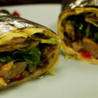 Shawerma Wrap · Beef or Chicken Shawerma wrap with tomatoes, lettuce, onions, turnips/pickles and sauce.
