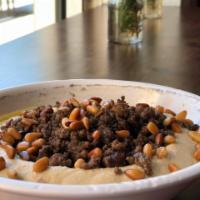 Hummus with Meat, Onions and Pine Nuts · A smooth medley of crushed chickpeas, garlic, lemon juice and tahini sauce drizzled with oli...