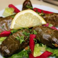 Grape Leaves 6 Pcs · A mixture of rice, finely diced tomato, parsley, onion and fresh mint rolled in grape leaves...