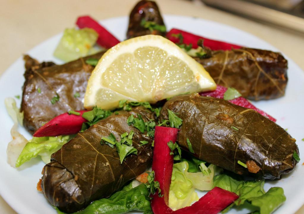 Grape Leaves 6 Pcs · A mixture of rice, finely diced tomato, parsley, onion and fresh mint rolled in grape leaves. Vegetarian.