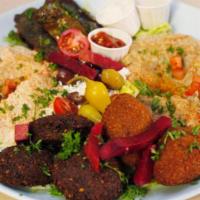 Beirut Mix Mezza Combo for 2 · Hummus, baba ghannouj, grape leaves, tabbouleh, and falafel and olives