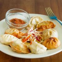 15. Momo Combo · Steamed or fried, served with homemade salad and homemade salsa.