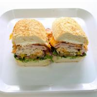 Jesse James Sandwich · Ham, turkey, cheddar, bacon, cream cheese and baja sauce. All sandwiches made with everythin...