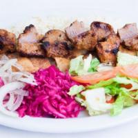 Beef Kabob Plate · Plate of basmati rice topped with a skewer of beef kabob and grilled vegetables. Served with...
