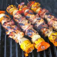 Chicken Kabob Plate · Plate of basmati rice topped with a skewer of chicken kabob and grilled vegetables. Served w...