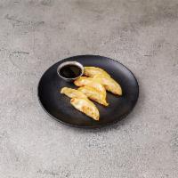 A8. Steamed Gyoza · 6 pieces. Dumpling with a minced filling. 