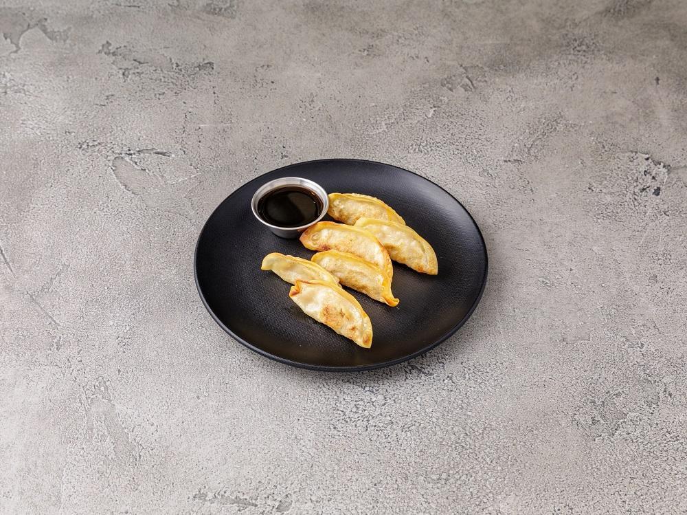 A8. Steamed Gyoza · 6 pieces. Dumpling with a minced filling. 
