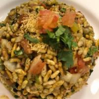 Dahi Batata Bhel Puri · Puffed rice with potatoes, tomato, tamarind, yogurt and herbs. A popular street snack.