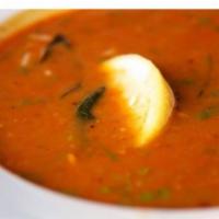 Nimma Rasam Soup · South Indian hot and sour soup made with tomato, tamarind, herbs and spices.