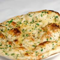Garlic Naan · Naan bread with minced garlic and cilantro.