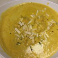 Chicken Korma · Mildly spiced in creamy cashew curry sauce with a dash of a saffron. Served with basmati ric...