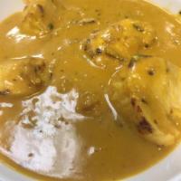 Amchuri Murgh · Tender pieces of chicken cooked in a chefs special mango spicy sauce. Served with basmati ri...