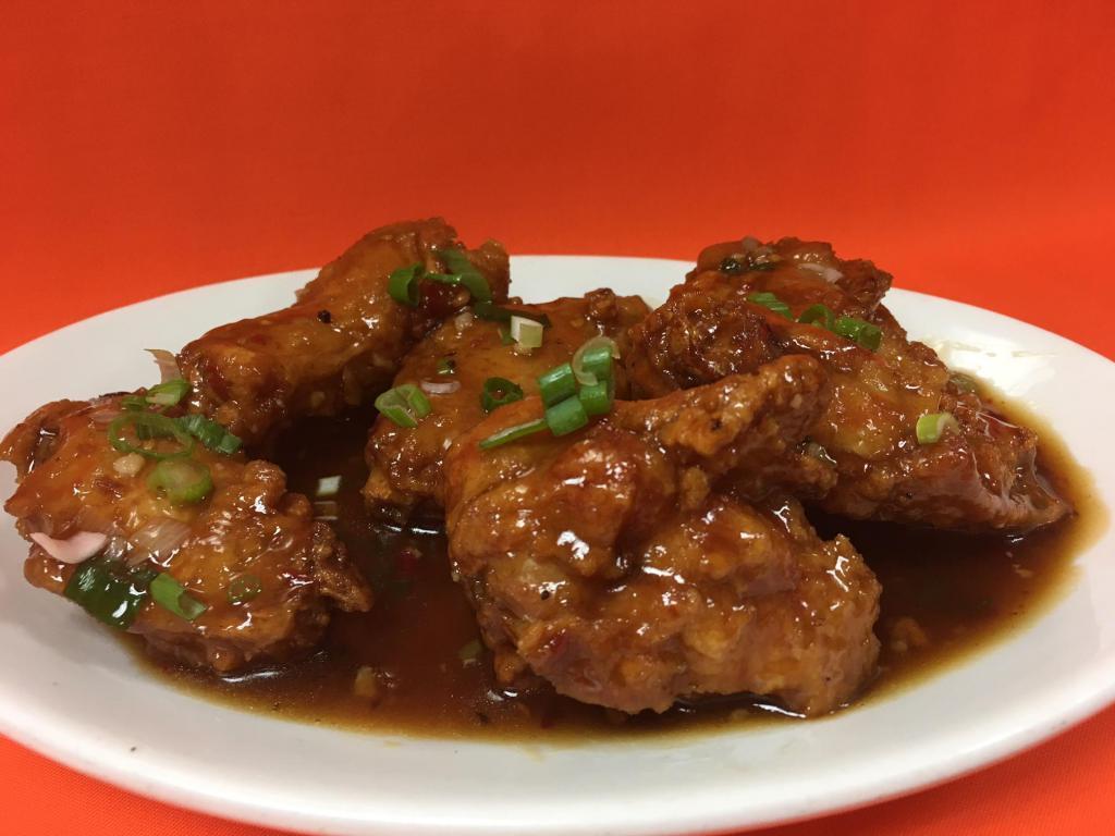 6 Pieces Chicken Wings and Legs · Deep fried Chicken wings and legs with sweet spicy sauce.