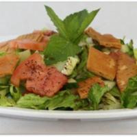 30. Fatoosh Salad · Lettuce, tomato, cucumber, bell pepper, onions, pita bread and dressing.