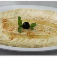 33. Baba Ghanoush · Crushed baked eggplant, yogurt, garlic and olive oil.