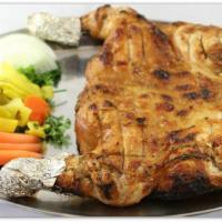 1. Whole Halal Tandoori Chicken · Chicken opened like butter fly .Cooked in clay oven Served with tomatoes, onions, pickles, g...