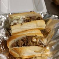Steak and Cheese Sub · Steak on a fresh roll with American cheese, onions, peppers and mushrooms.