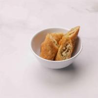 2. Spring Roll · 2 pieces. Crispy rice paper filled with shredded vegetables.