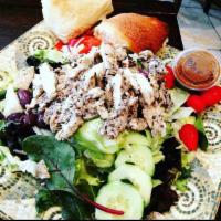 Grilled Chicken Salad · Grilled chicken over mixed greens with cucumbers, tomatoes, onions, olives, roasted red pepp...