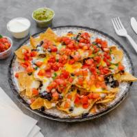 Nachos with Chorizo · Freshly made corn chips smothered with black or pinto beans, melted Jack and cheddar cheeses...