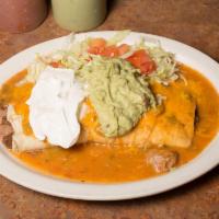 15. Burrito Supreme · Ground beef and bean burrito smothered, topped with sour cream and guacamole.