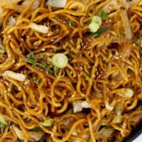 Vegetable Fried Noodles · Yakisoba noodles pan fried with cabbage, peppers and onions, garnished with sesame seeds. 