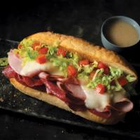 Italian Sub · Ham, salami, provolone cheese, lettuce and tomatoes. Served with a side of Italian dressing....