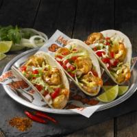 Baja Shrimp Tacos · Seasoned and grilled then loaded with cabbage, pico de gallo and a special sauce and wrapped...