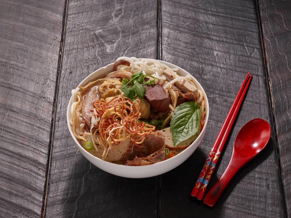 9. Bun Bo Hue · Hot and spicy soup, beef, pork ball and pork with vermicelli. Spicy.