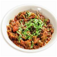 Bhindi Masala · Fresh okra sauteed with onions and spices. Vegetarian.