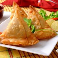 Samosa ( 2 Piece ) · 2 handmade pastry shells stuffed with potatoes roasted in spices. Served with side of season...