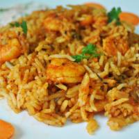 Shrimp Biryani · Basmati rice cooked with shrimp and spices. Served with raita (yogurt).